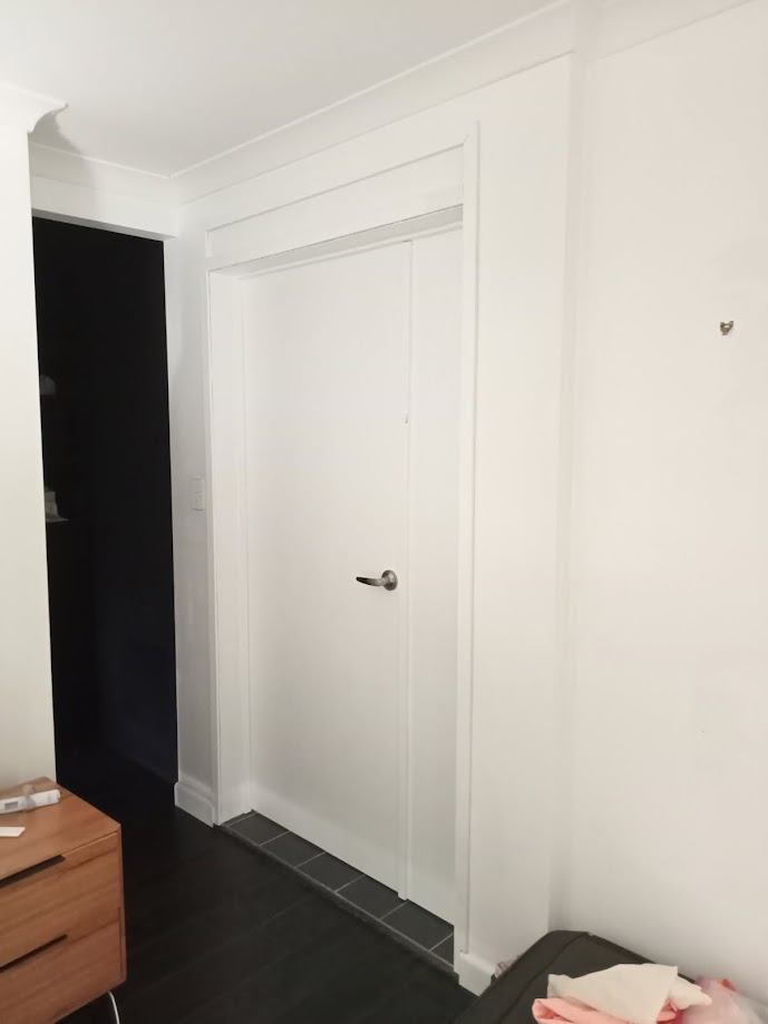 Custom solution by Beyond the Blueprint for an extra-wide ensuite opening: built new frame, installed elegant dual doors, restoring amazing privacy for a very satisfied customer.